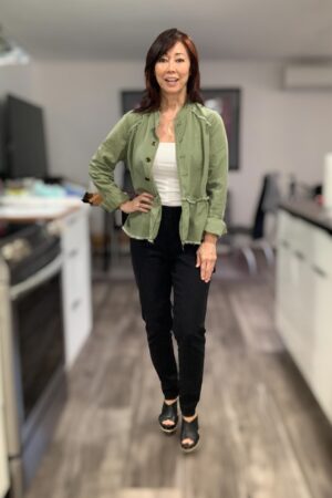 black work pants with green peplum jacket and ivory cami