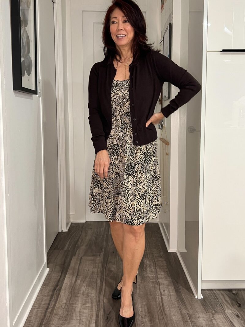 dark brown and cream print ruffled dress with cardigan and slingback sandals